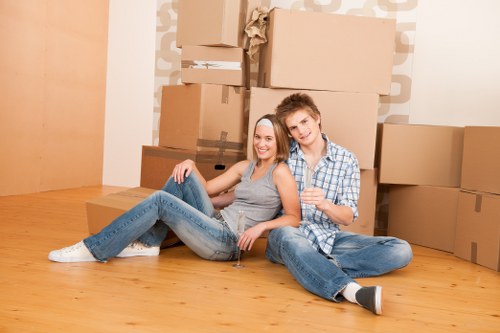 Local moving team organising boxes in a Tower Hill property