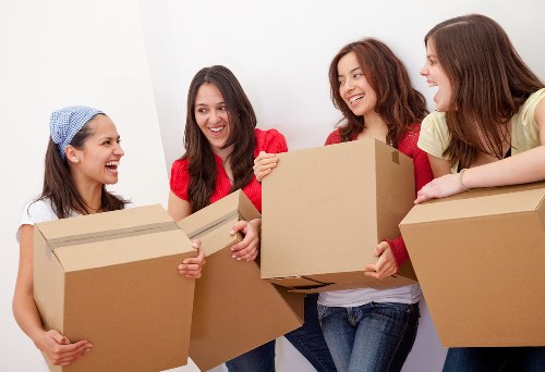 Packed office boxes and furniture ready for a Tower Hill business move