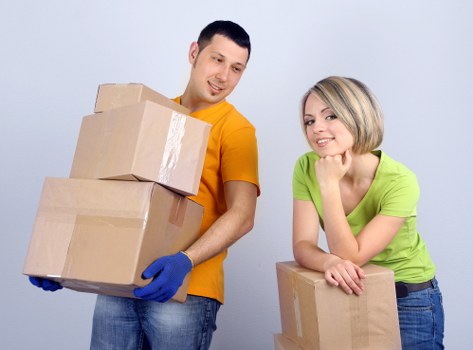 Packed office furniture and boxes ready for relocation in Tower Hill